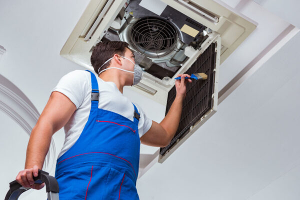 man-repairing-air-conditioner